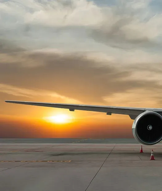 Airplane wing at sunset