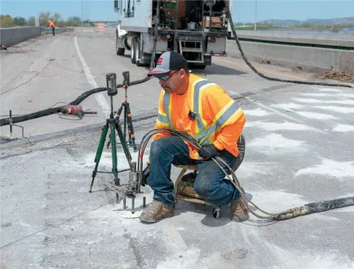 URETEK technicians in baseball cap tests worksite