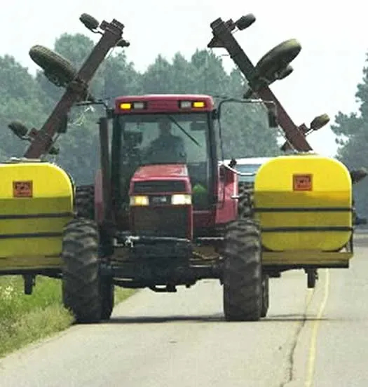Large agricultural equipment on roadway