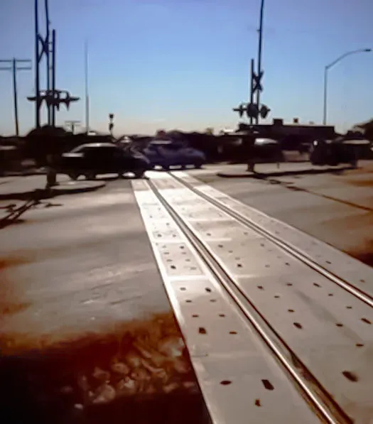 Railroad crossing on sunny day at angle