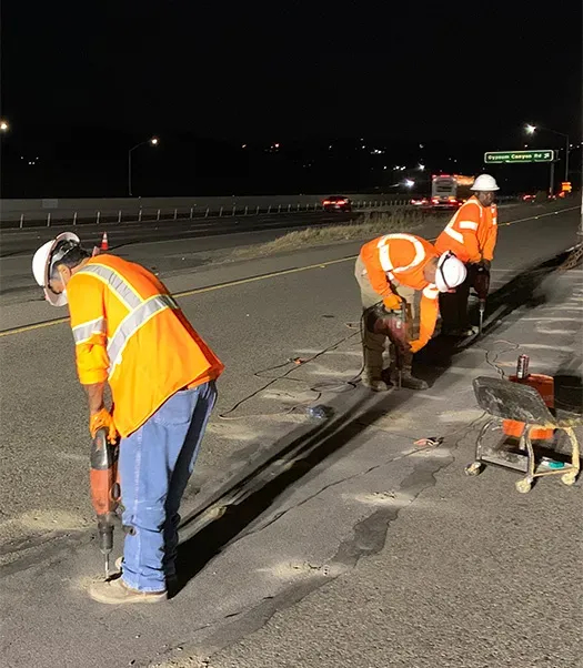 Three URETEK technicians at work on night