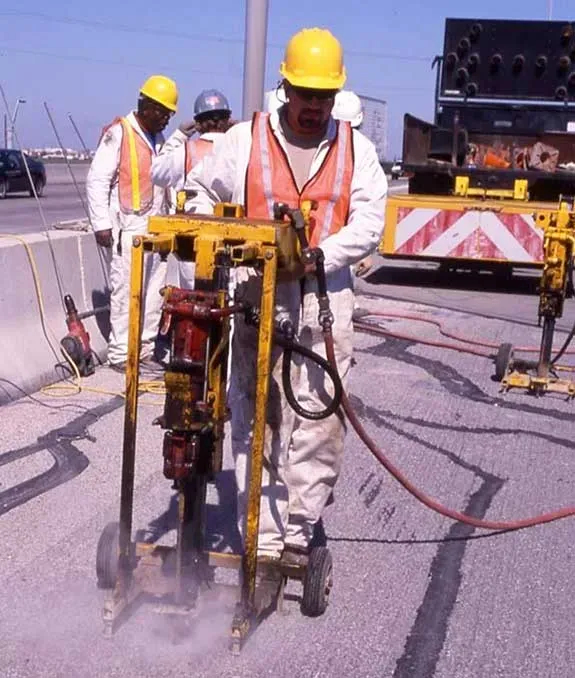 Technicians drilling holes for URETEK Deep Injection in Corpus Christi